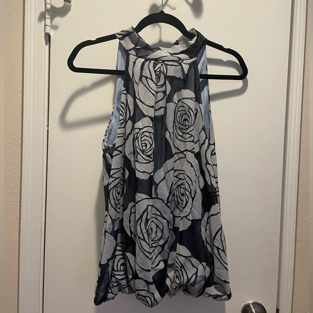 Dark blue and light blue floral print blouse with bow tie in the back